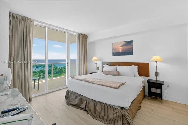 a bedroom with a large bed and a large window