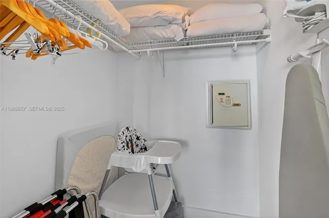 a bathroom with a sink and mirror with toilet