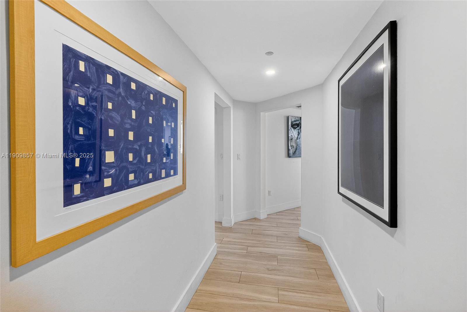 2889 McFarlane Road, Unit 1001 Miami, FL 33133 - Photo 19 of 35 a view of a hallway with wooden floor and staircase
