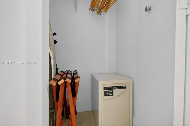 a view of walk in closet with clothes