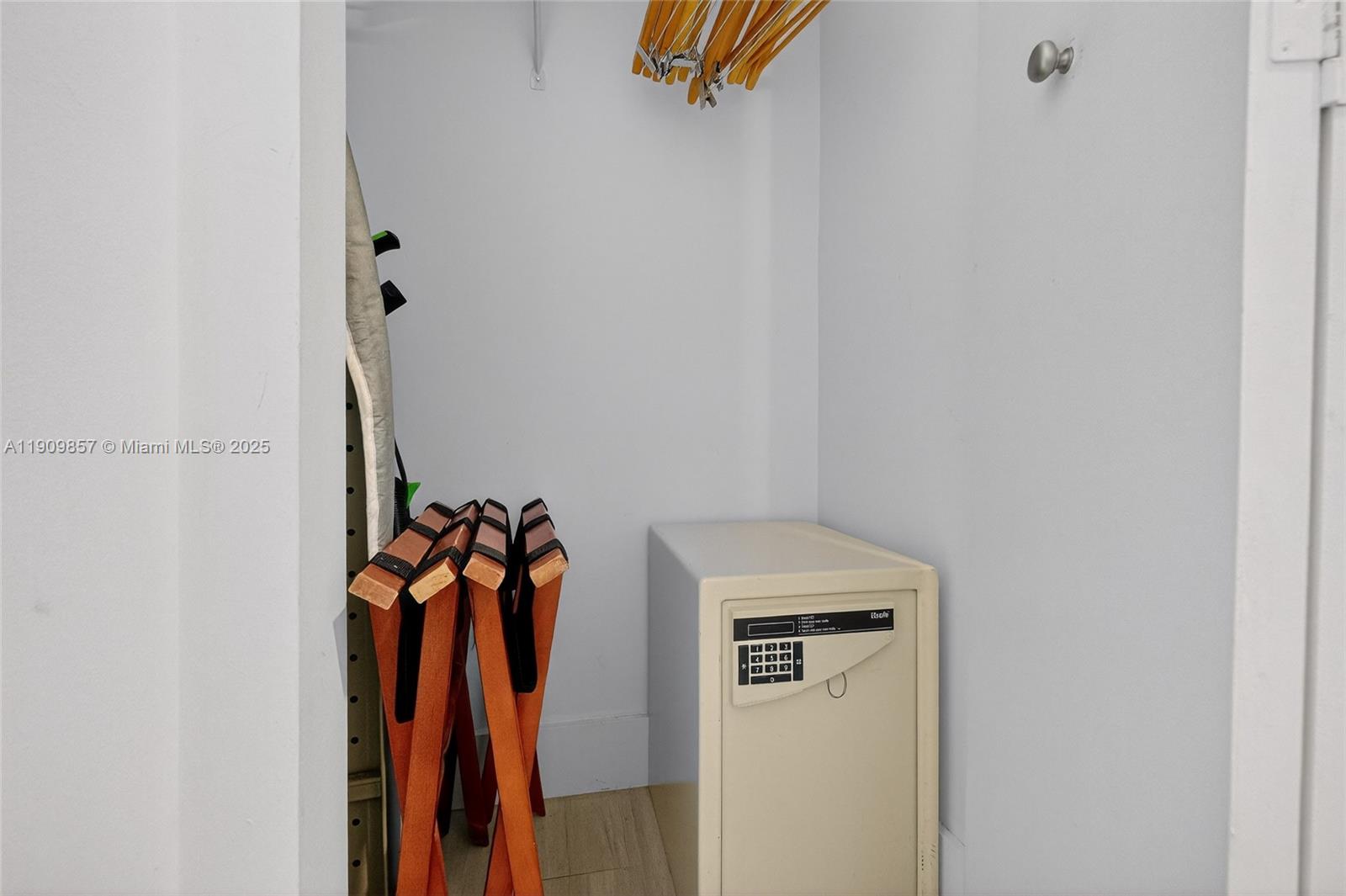 2889 McFarlane Road, Unit 1001 Miami, FL 33133 - Photo 21 of 35 a view of walk in closet with clothes