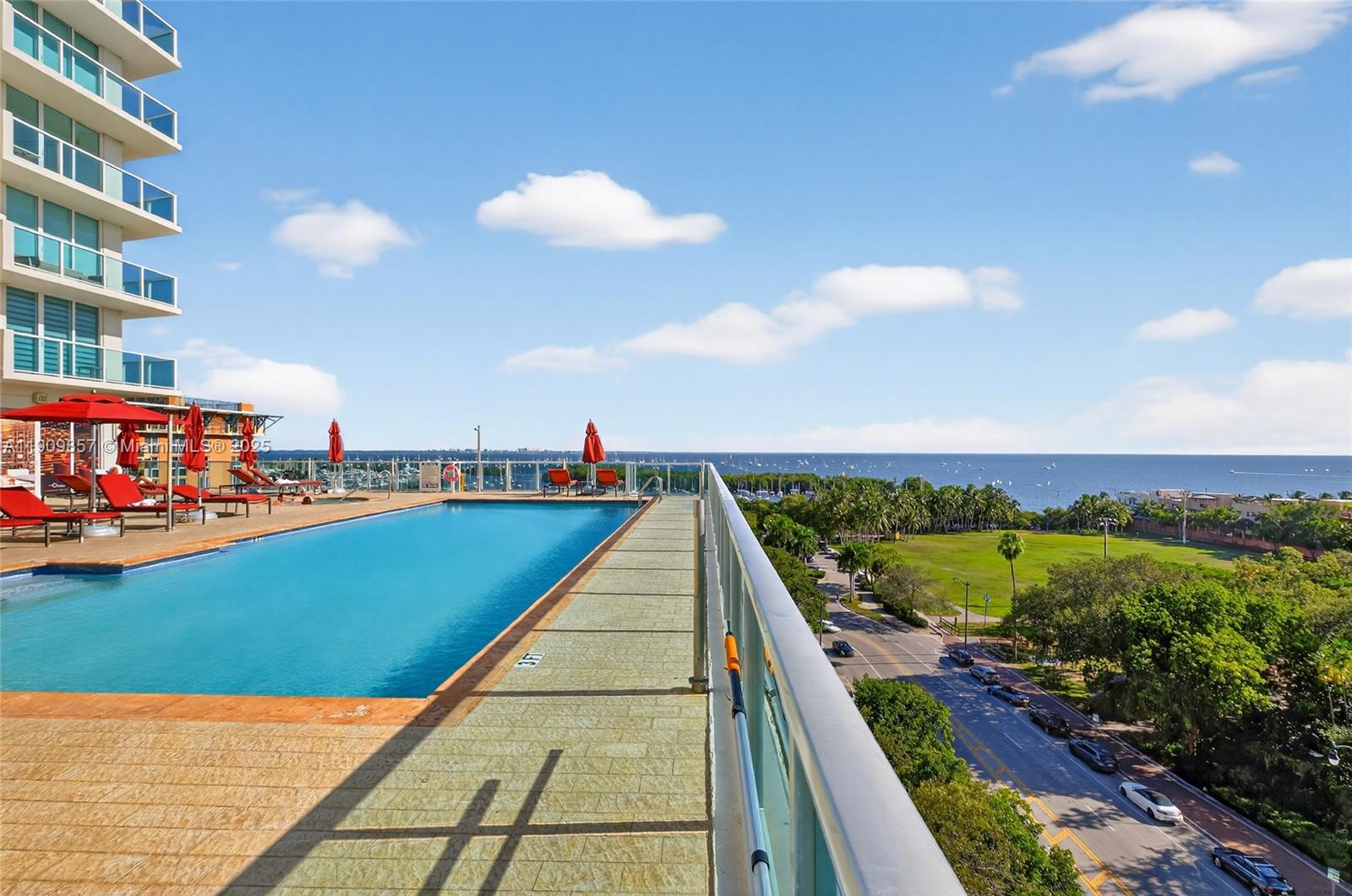 2889 McFarlane Road, Unit 1001 Miami, FL 33133 - Photo 27 of 34 a view of swimming pool from a balcony