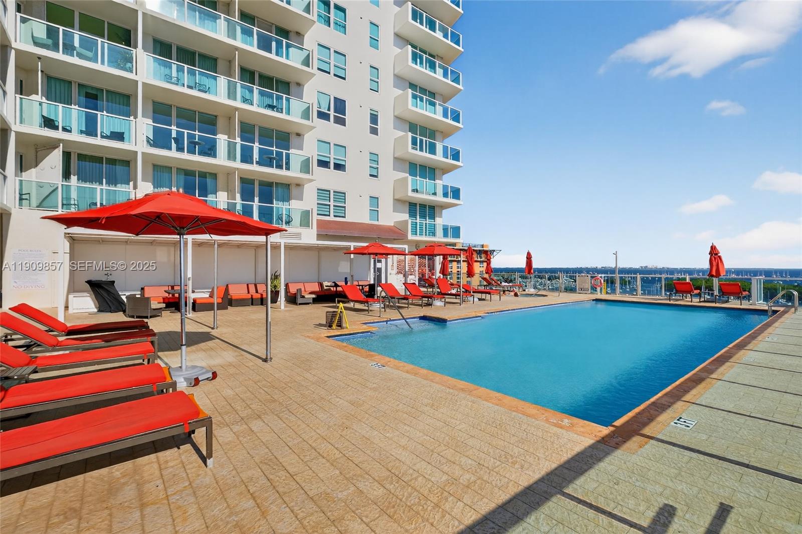 2889 McFarlane Road, Unit 1001 Miami, FL 33133 - Photo 28 of 34 a view of pool with an outdoor seating