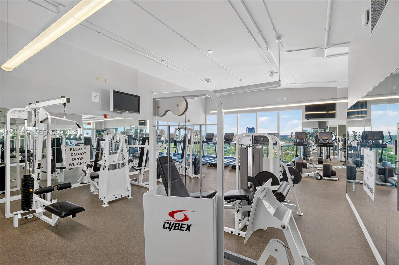 2889 McFarlane Road, Unit 1001 Miami, FL 33133 - Photo 32 of 34 a view of a room with gym equipment