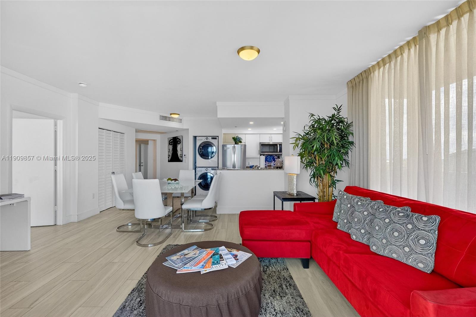 2889 McFarlane Road, Unit 1001 Miami, FL 33133 - Photo 6 of 35 a living room with furniture and wooden floor