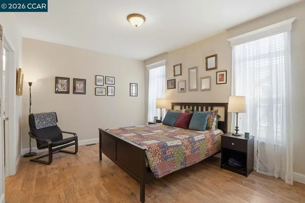 a bedroom with a bed and a couch