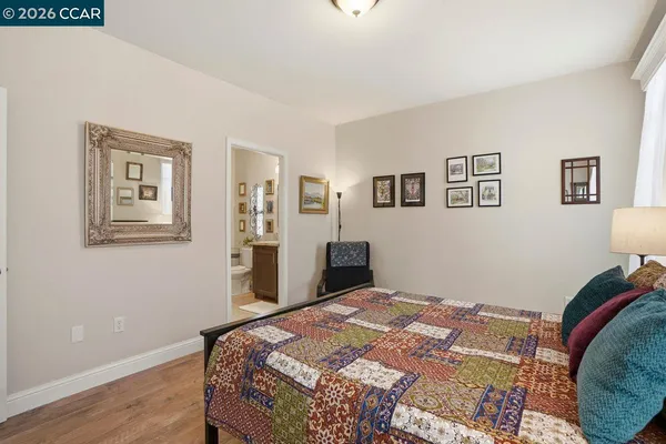 a bedroom with bed and cupboard