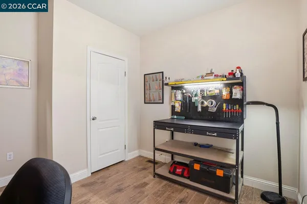 a room with furniture and a wooden floor