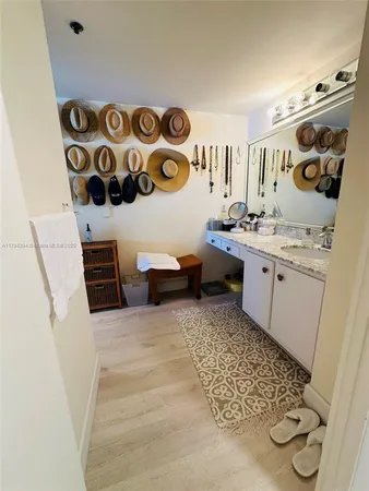a spacious bathroom with a sink and a mirror