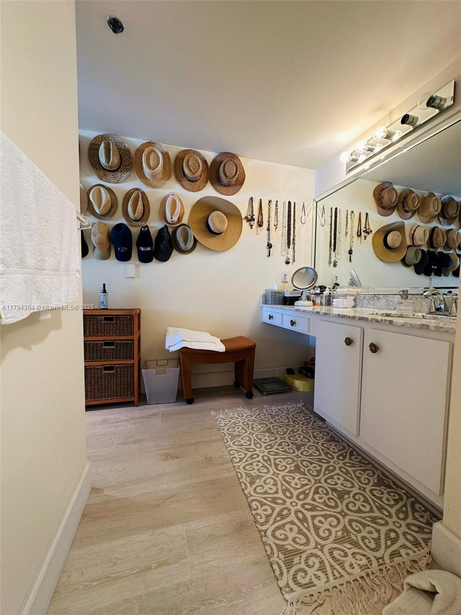 4750 South Ocean Boulevard, Unit 401 Highland Beach, FL 33487 - Photo 22 of 47 a spacious bathroom with a sink and a mirror