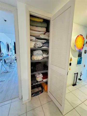 a room with gym equipment and a table