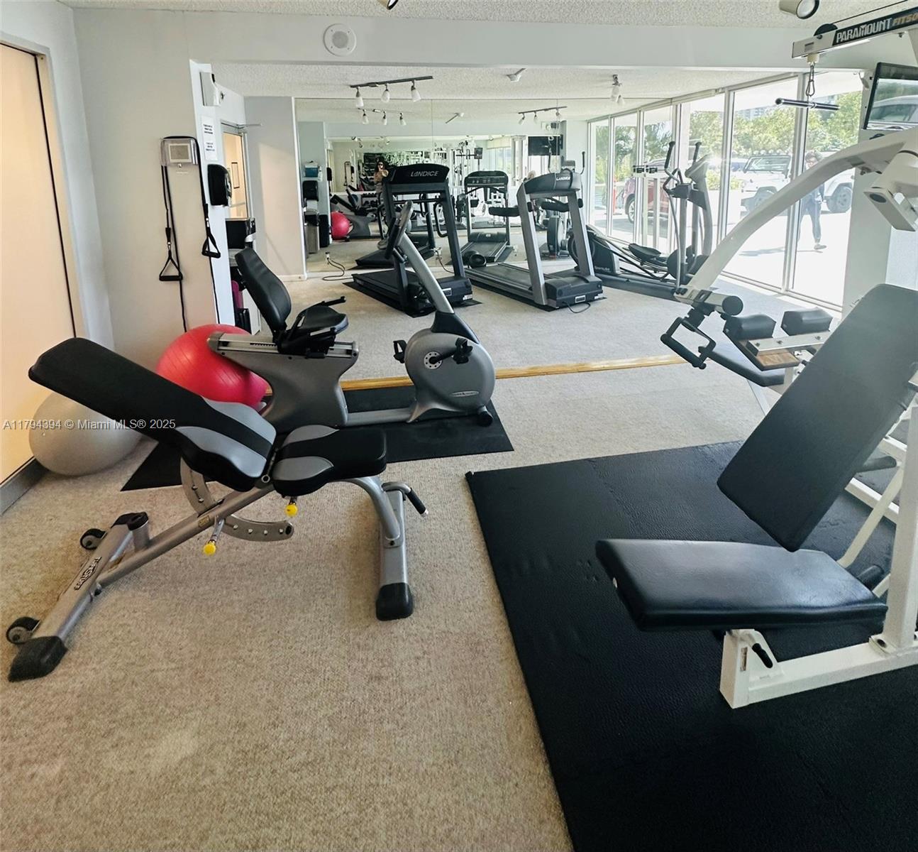 4750 South Ocean Boulevard, Unit 401 Highland Beach, FL 33487 - Photo 25 of 47 a room with gym equipment and a table