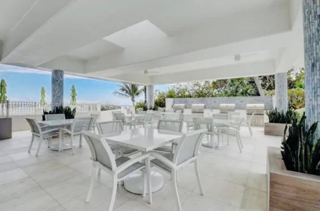 4750 South Ocean Boulevard, Unit 401 Highland Beach, FL 33487 - Photo 30 of 47 a view of a dining room with furniture window and outside view