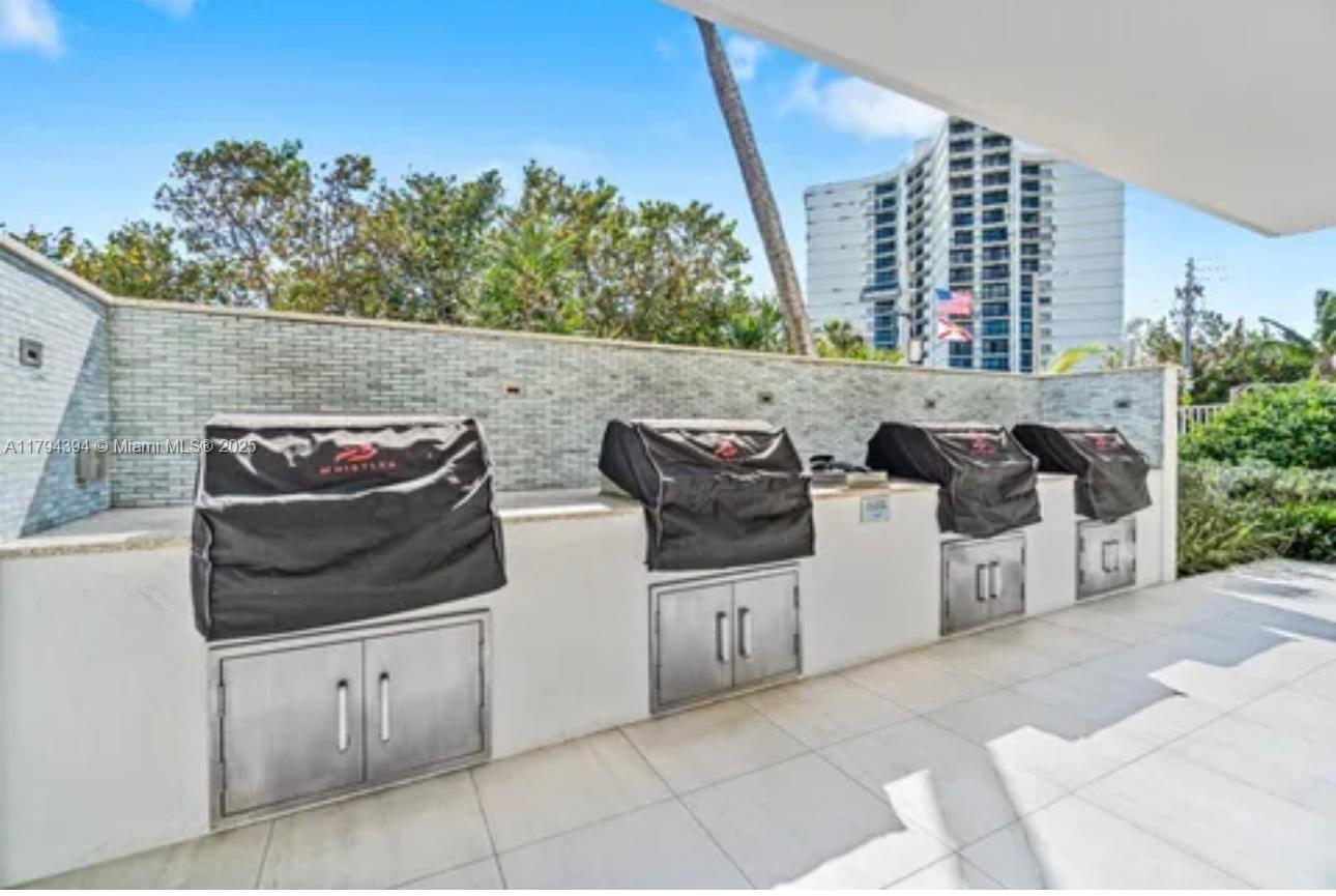 4750 South Ocean Boulevard, Unit 401 Highland Beach, FL 33487 - Photo 39 of 47 a view of outdoor space and barbecue grill