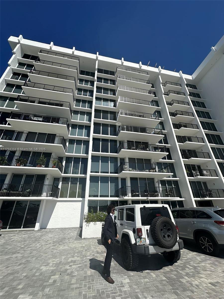 4750 South Ocean Boulevard, Unit 401 Highland Beach, FL 33487 - Photo 9 of 47 a view of a balcony with lots of car parked