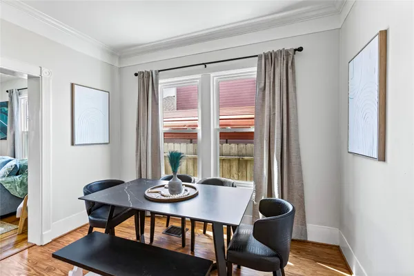 a view of a dining room with furniture and window