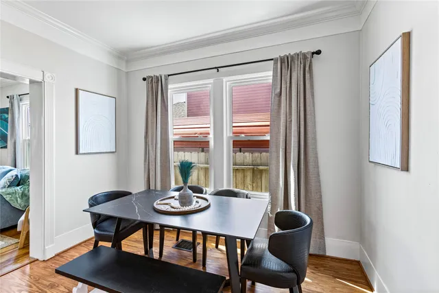 a view of a dining room with furniture and window