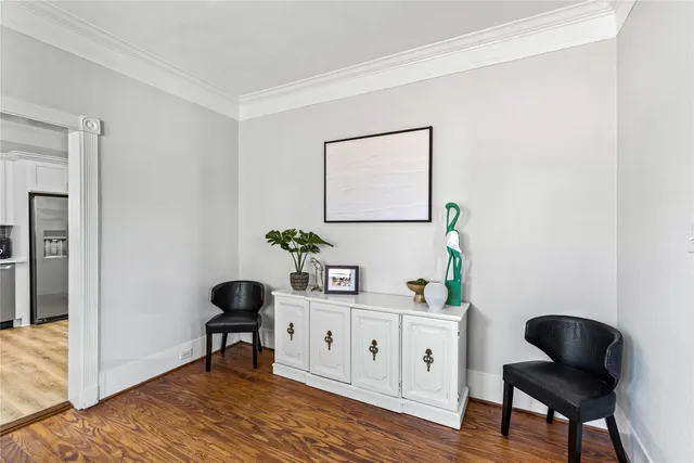 a workspace room with furniture and wooden floor