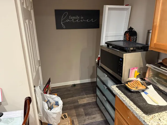 a kitchen with a stove and a refrigerator