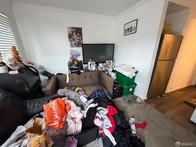 a kitchen with a sink a stove and cabinets