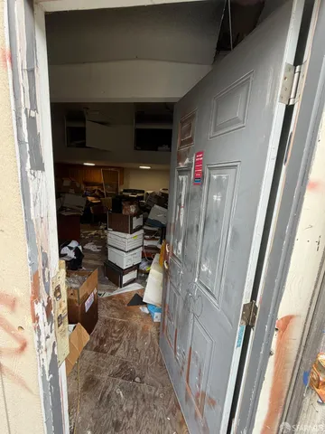 a living room with lots of furniture and appliances