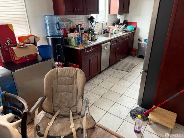 a room with a chair and gym equipment