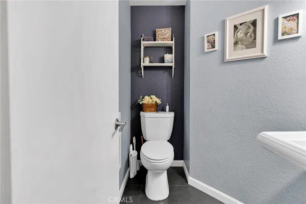 a bathroom with a toilet and a sink