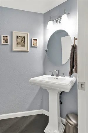 a view of a hallway with bathroom and shower