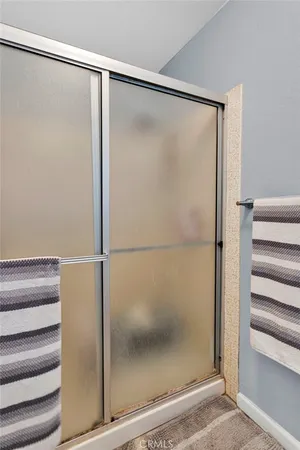 a bathroom with a sink toilet vanity and shower