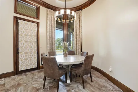 a view of a dining room with furniture and window