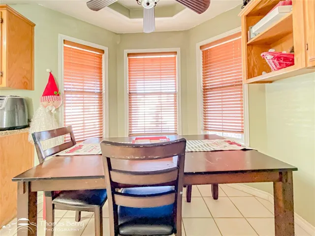 a dining room table and chairs in a room