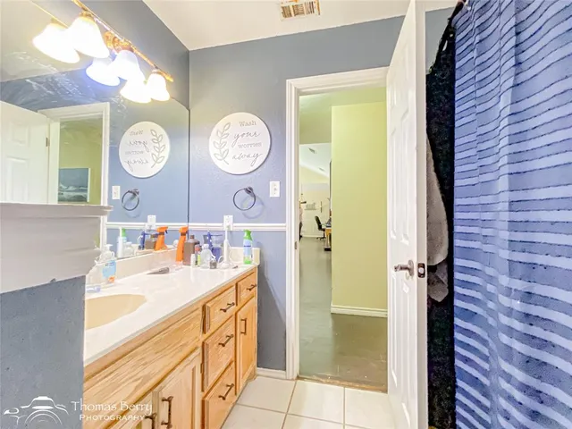 a bedroom with a bed and a table