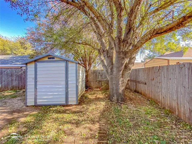a front view of a house with patio and yard