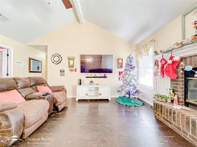 a living room with furniture and flowers