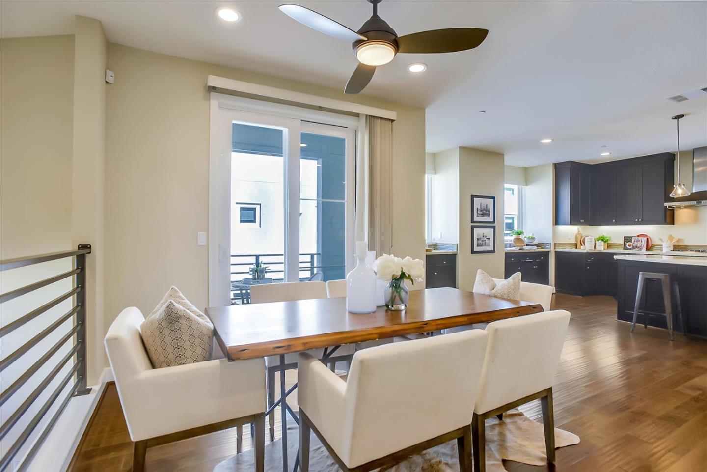 402 Neves Road San Mateo, CA 94403 - Photo 11 of 31 a dining room with furniture and wooden floor