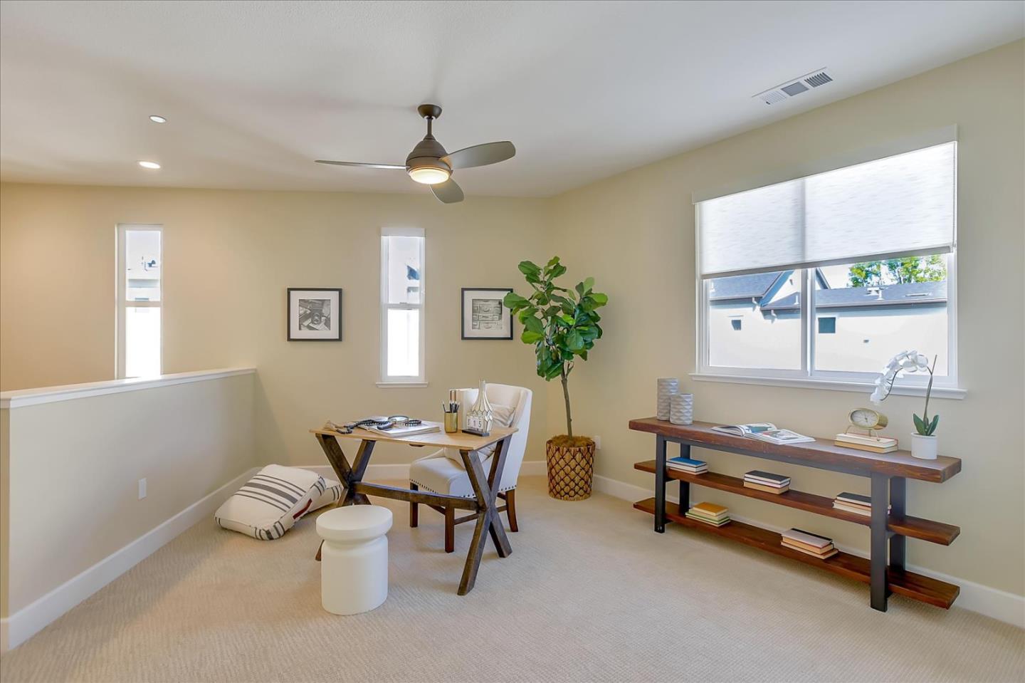402 Neves Road San Mateo, CA 94403 - Photo 16 of 31 a living room with furniture and a chandelier