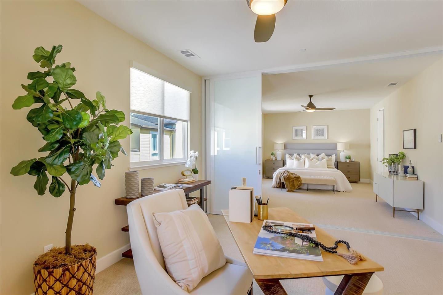 402 Neves Road San Mateo, CA 94403 - Photo 17 of 31 a living room with furniture flowerpot and a potted plant