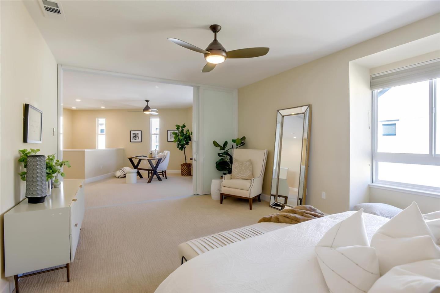 402 Neves Road San Mateo, CA 94403 - Photo 19 of 31 a bedroom with furniture and a chandelier