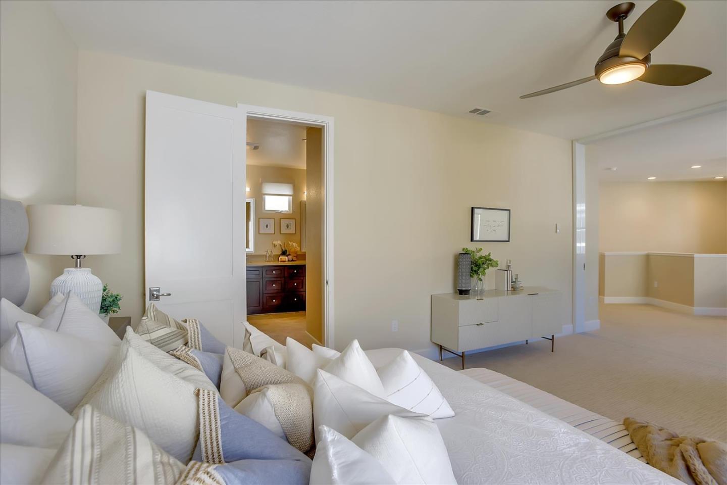 402 Neves Road San Mateo, CA 94403 - Photo 21 of 31 a bedroom with furniture and a chandelier