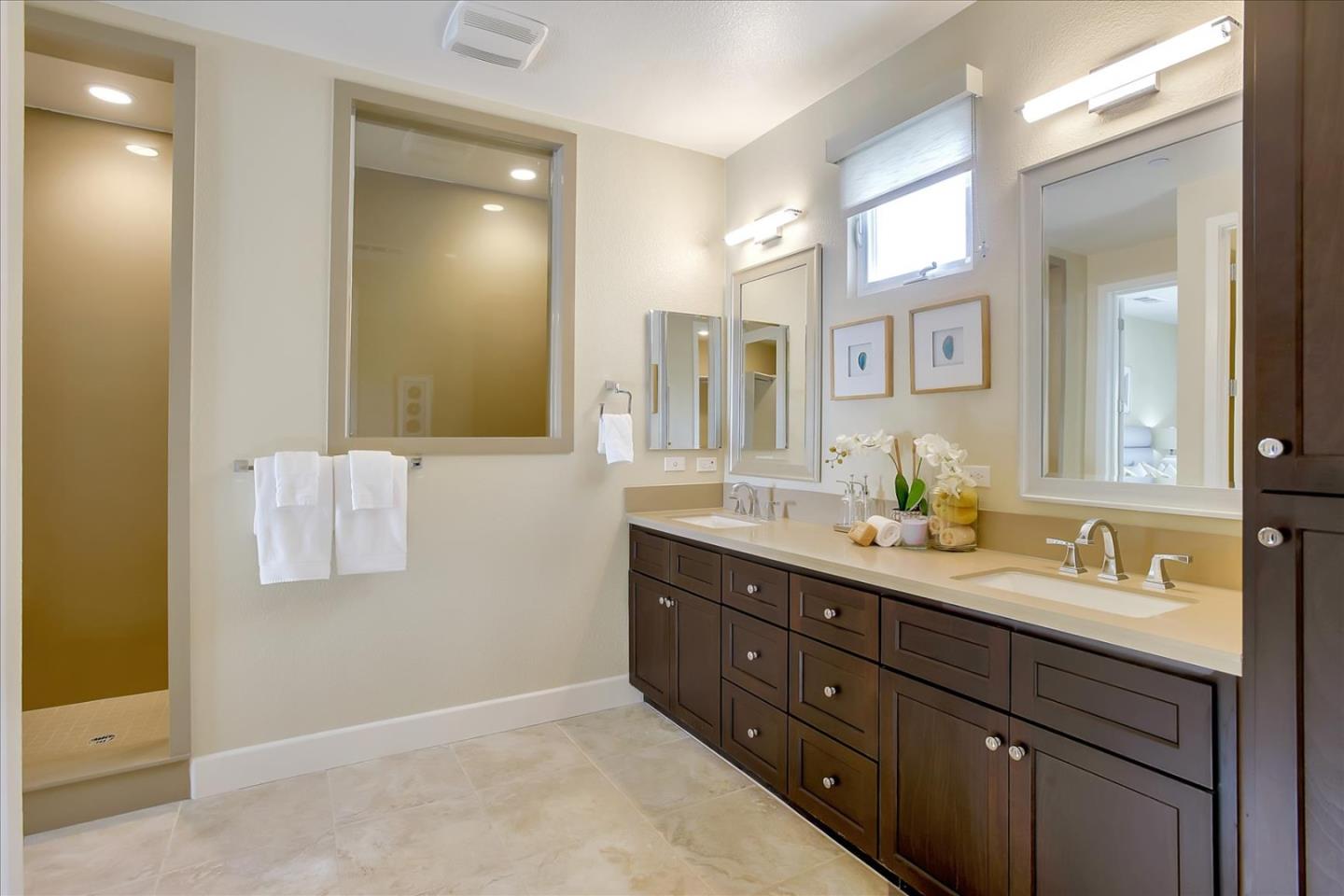 402 Neves Road San Mateo, CA 94403 - Photo 24 of 31 a bathroom with a granite countertop sink mirror and double