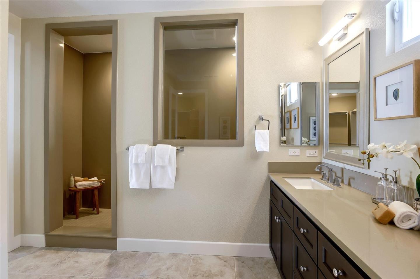 402 Neves Road San Mateo, CA 94403 - Photo 25 of 31 a bathroom with a sink and mirror
