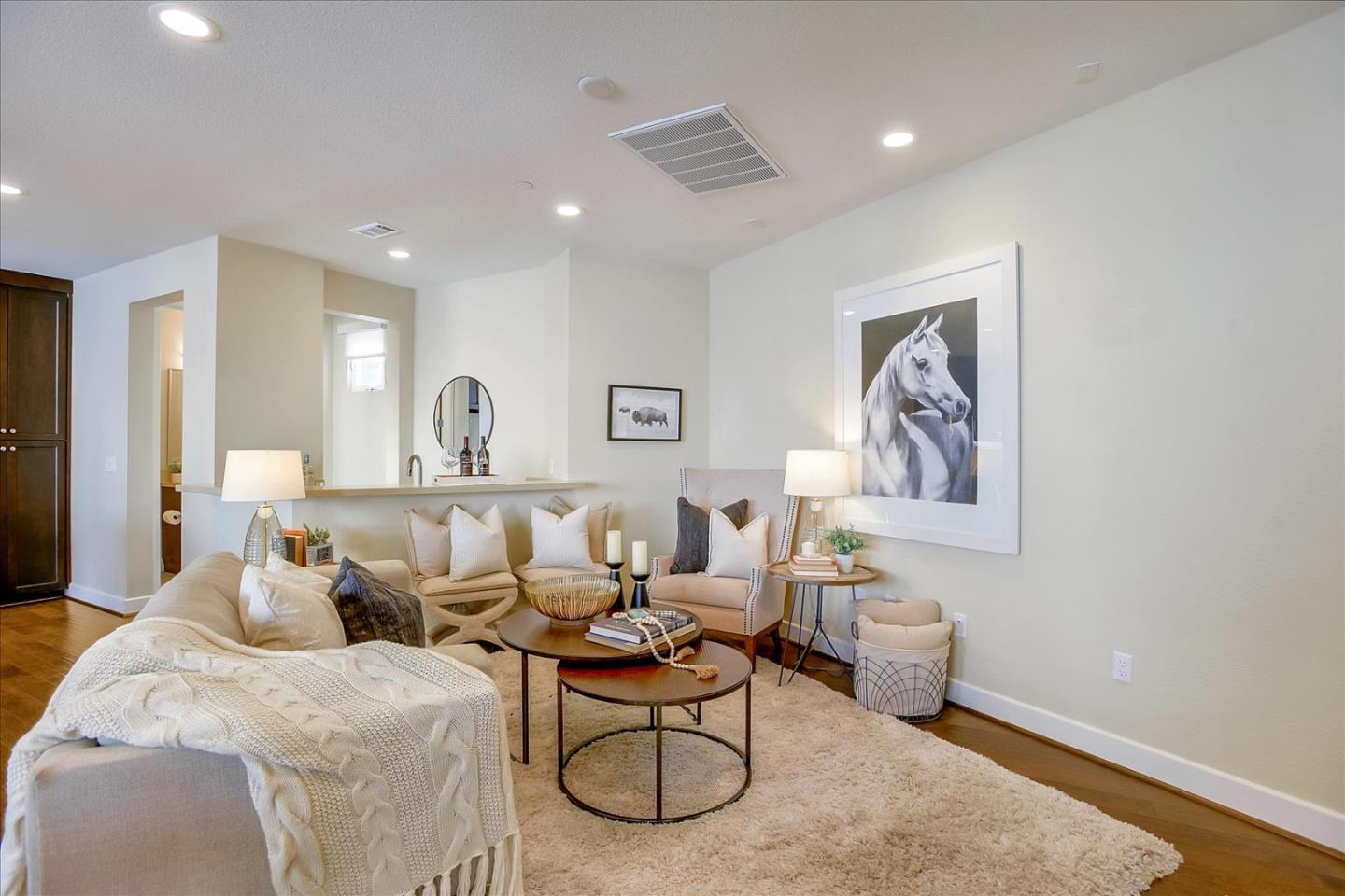 402 Neves Road San Mateo, CA 94403 - Photo 4 of 31 a living room with furniture a rug and white walls