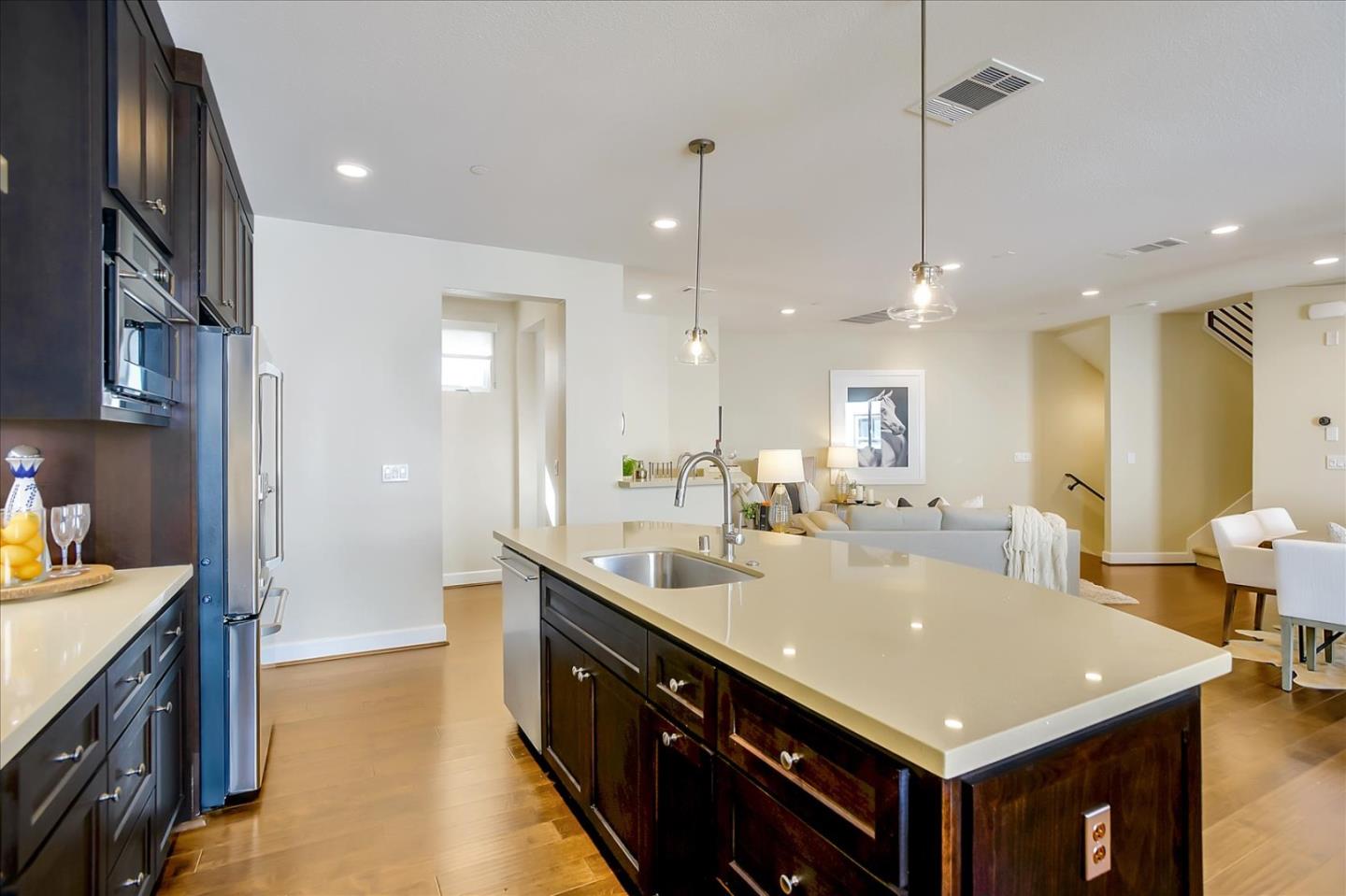 402 Neves Road San Mateo, CA 94403 - Photo 9 of 31 a large kitchen with kitchen island a sink a counter space and stainless steel appliances