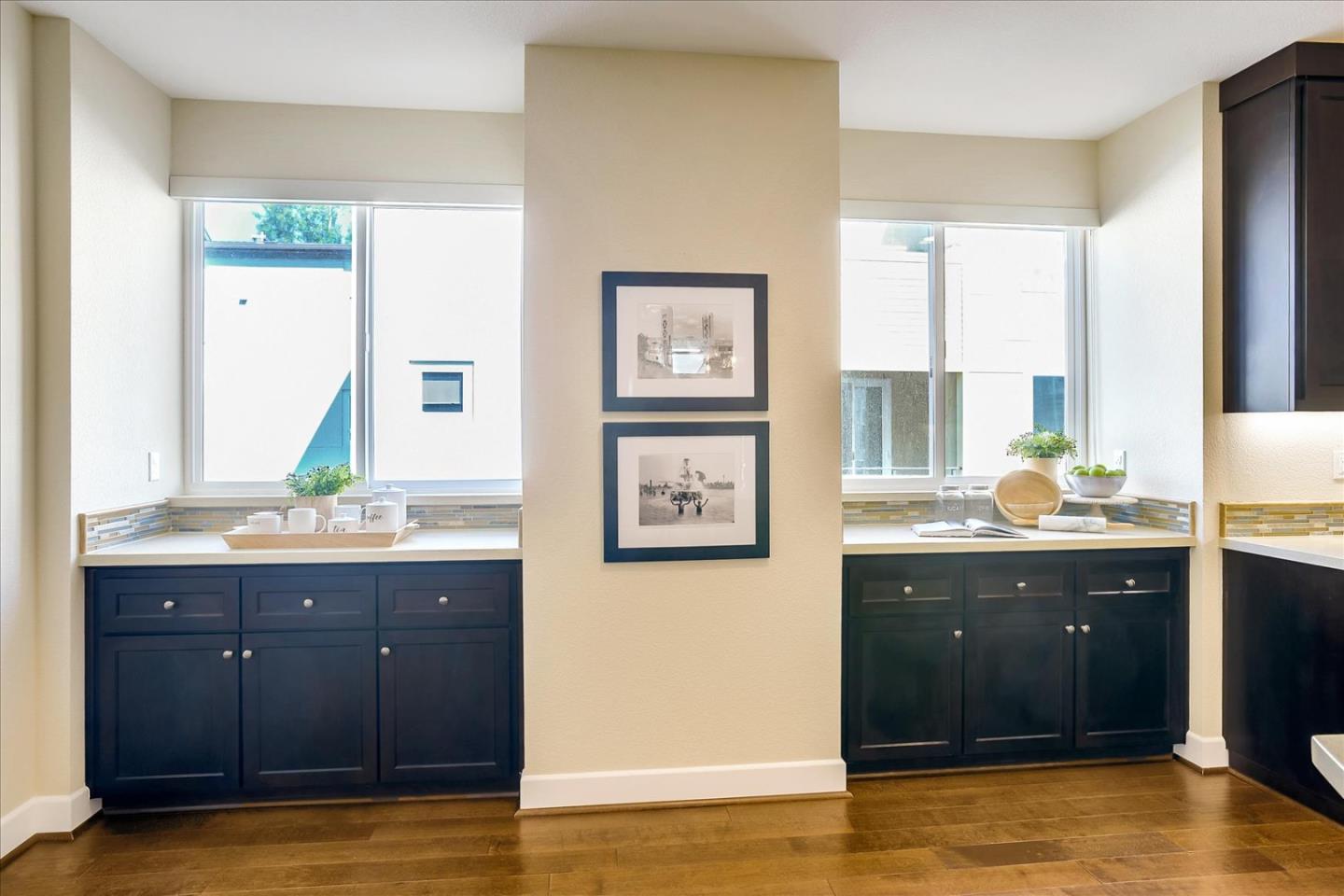 402 Neves Road San Mateo, CA 94403 - Photo 10 of 31 a bathroom with a granite countertop sink and a large mirror