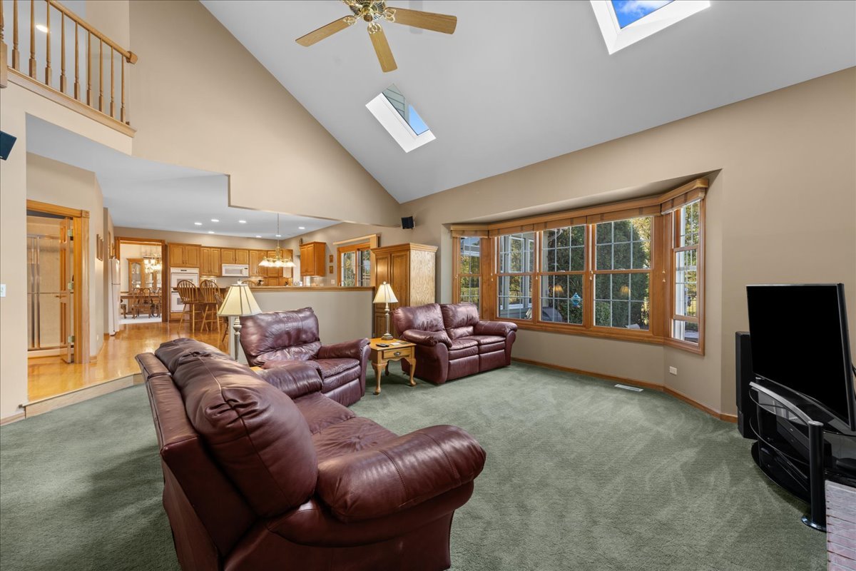 36W824 Red Gate Court St. Charles, IL 60175 - Photo 14 of 39 a living room with furniture and a flat screen tv