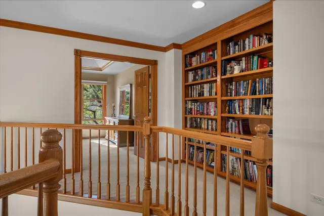 a view of a living room that has a book shelf