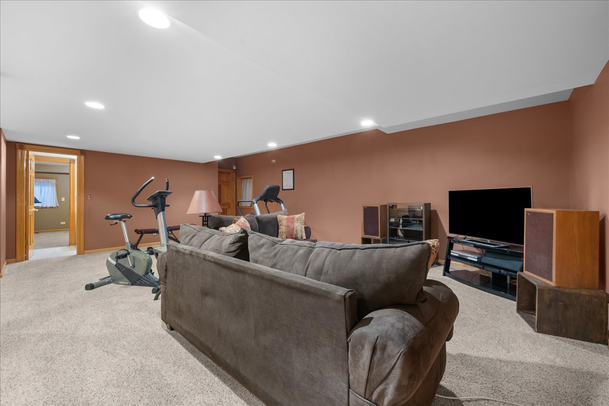 36W824 Red Gate Court St. Charles, IL 60175 - Photo 29 of 39 a living room with furniture and a flat screen tv