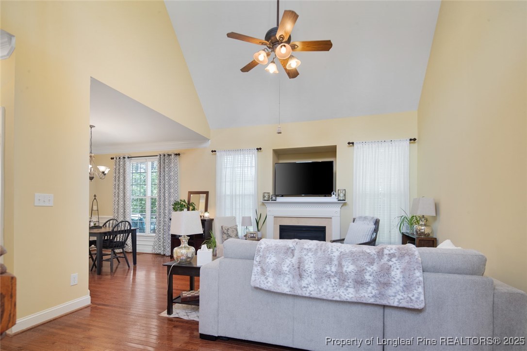 15 London Way Spring Lake, NC 28390 - Photo 11 of 46 a living room with furniture a fireplace and a flat screen tv