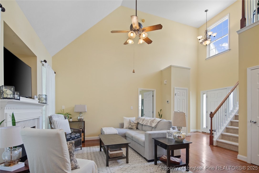 15 London Way Spring Lake, NC 28390 - Photo 12 of 46 a living room with furniture a flat screen tv and kitchen view