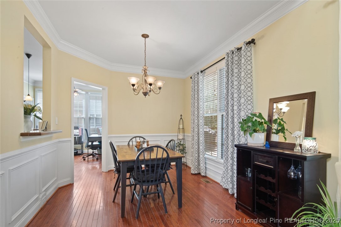 15 London Way Spring Lake, NC 28390 - Photo 15 of 46 a view of a dining room with furniture and wooden floor